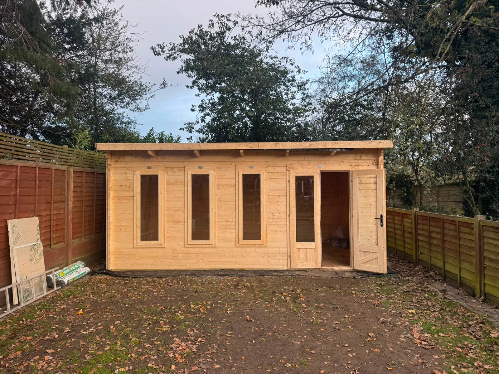 The installed summer house in a Cheam garden