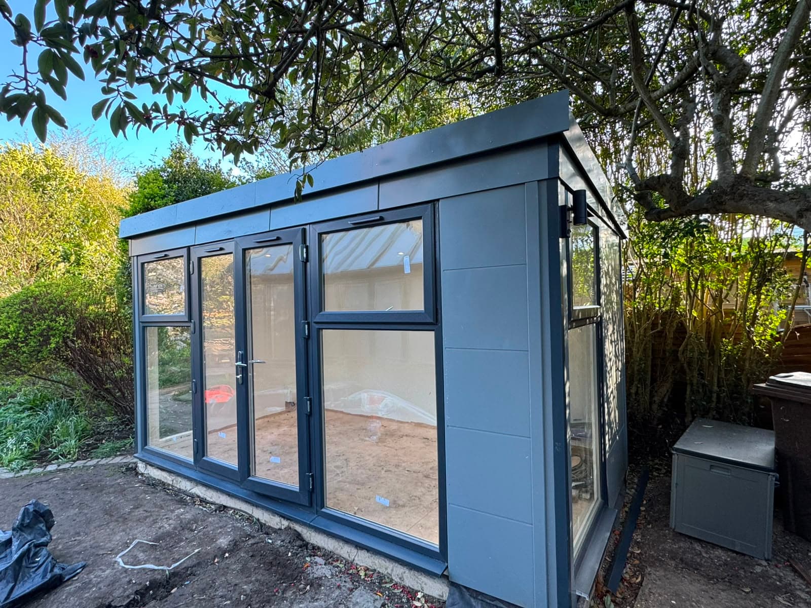 The finished summer house with the garden around it