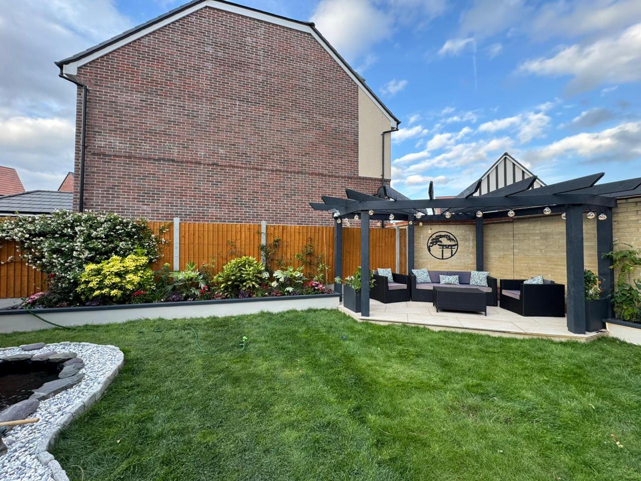 A full garden landscaping project with new lawn, borders and patio